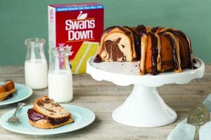Bundt Cake With Chocolate And Peanut Butter Drizzle, Milk, And Cake Flour Box