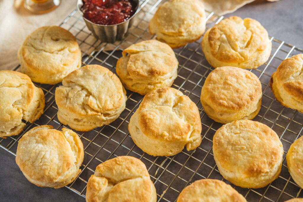 freshly baked buttermilk biscuits on a baking rack