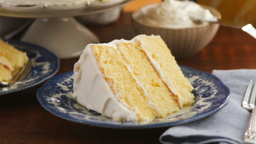 Slice of 1-2-3-4 Layer Cake with white frosting