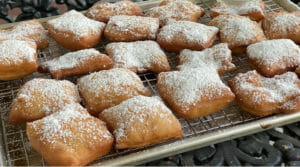 Beignets Made With Cake Flour On Cooling Rack