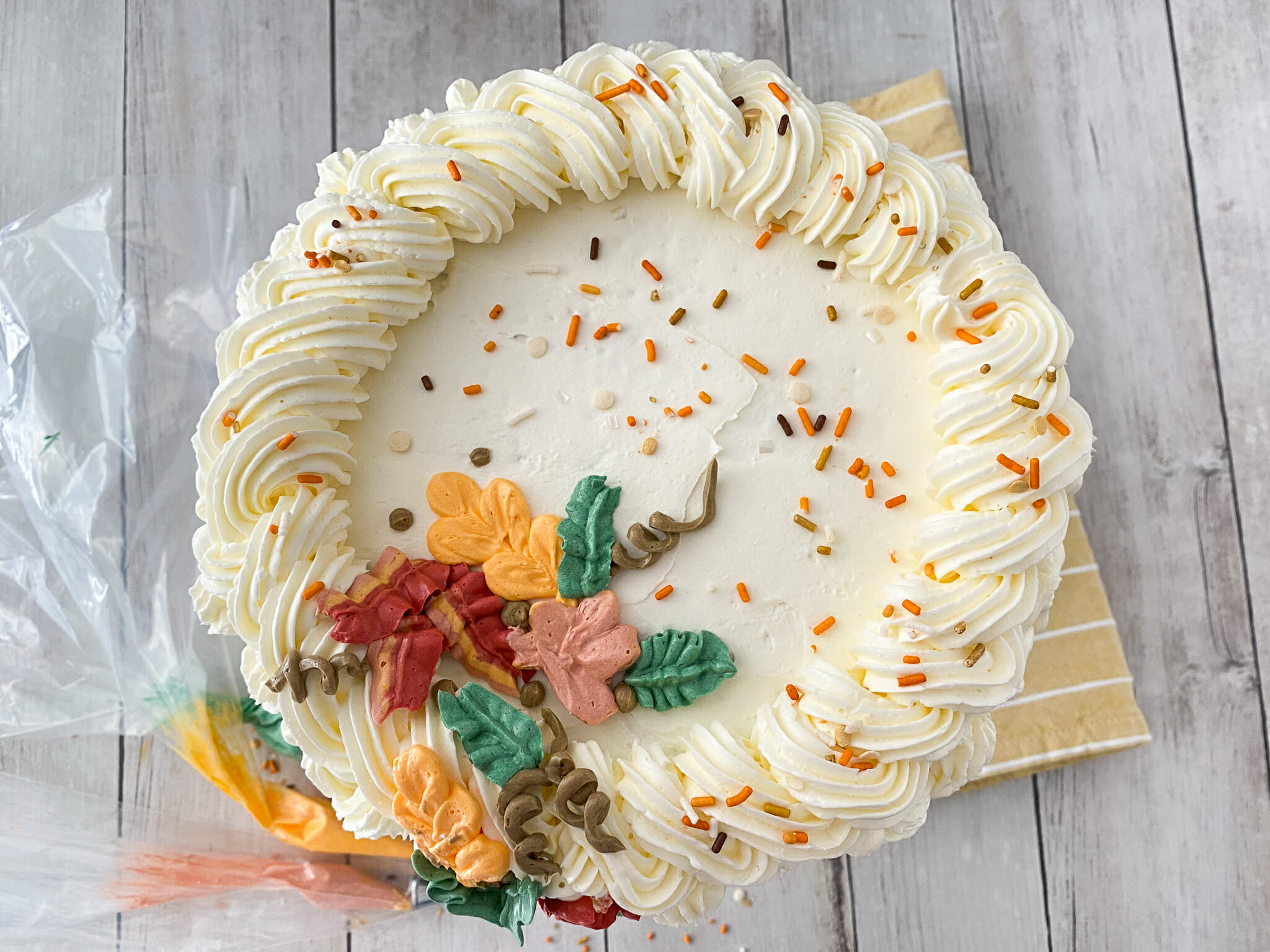 Vanilla-Frosted Cake With Fall Leaves