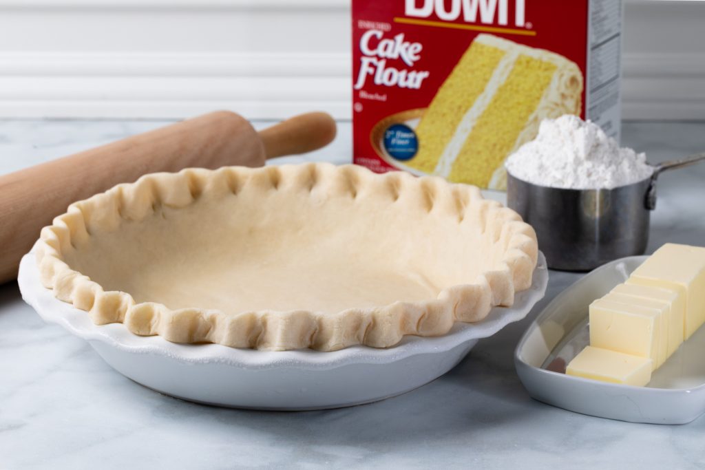 Freshly made pie dough shaped into a pie pan