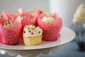 Lemon Cupcakes With Colorful Sprinkles On Cake Stand