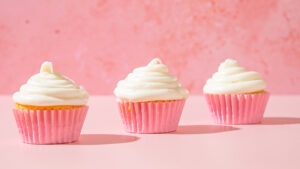 3 cupcakes lavishly topped with ermine frosting