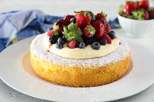 A Genoise Cake topped with fresh berries