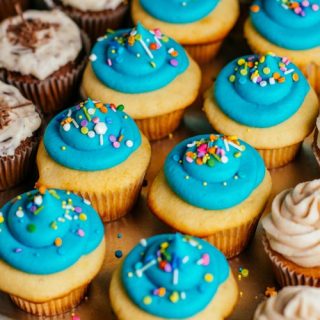 cupcakes with blue frosting and sprinkles