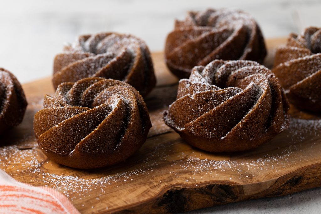 Pumpkin Spice Latte Mini Bundt Cakes dusted with powdered sugar