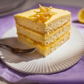 Lemon Cake what Buttercream Frosting slice on serving plate