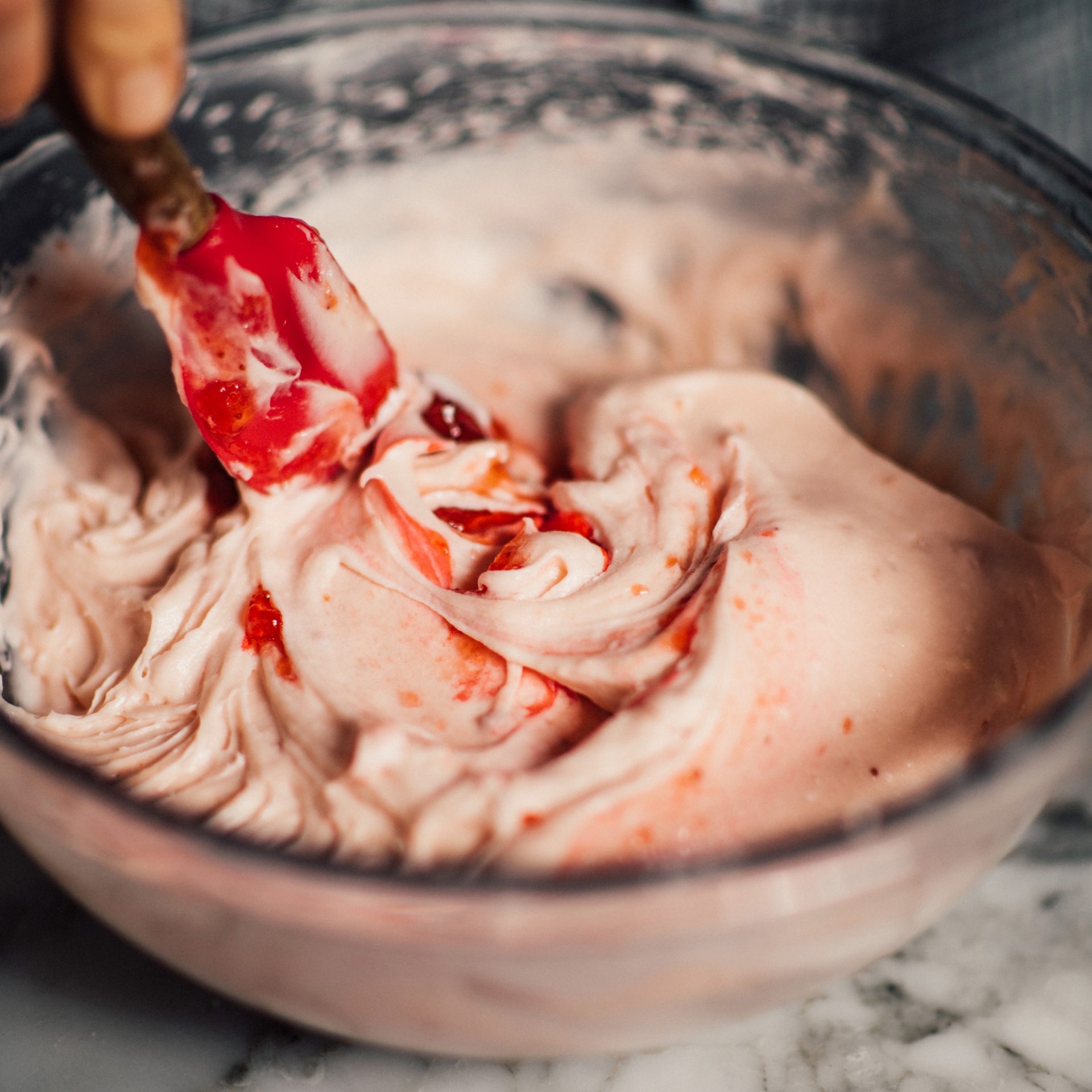 Bowl of batter for Strawberry Preserves Cake being hand mixed