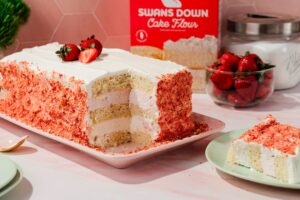 strawberry crunch ice cream cake on serving plate